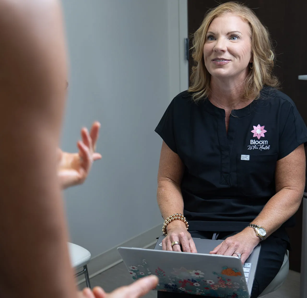 A Bloom La Vie Health provider talking a patient through her hormone results