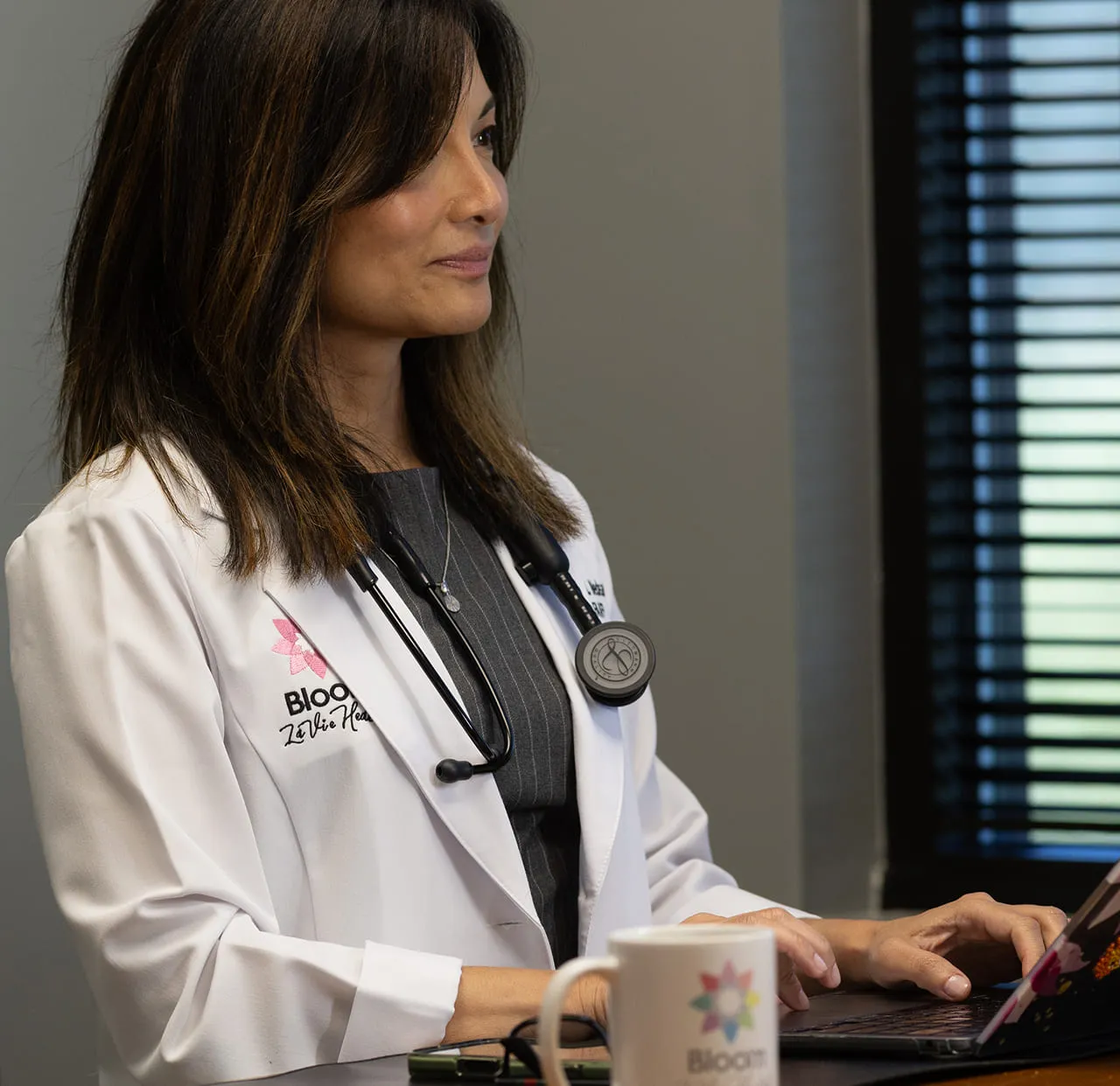 Dr. Nedeau going through a genetic report on screen at the clinic