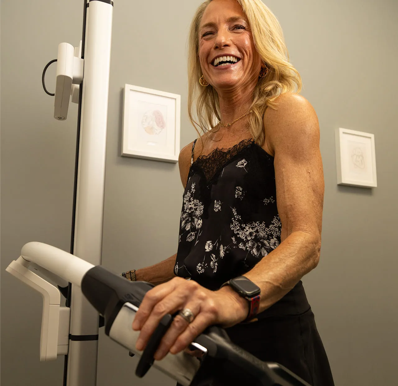 A patient stepping onto the clinic’s body composition analyzer