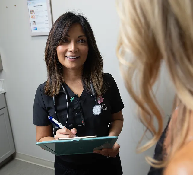 Dr. Nedeau reviewing a treatment plan with a patient